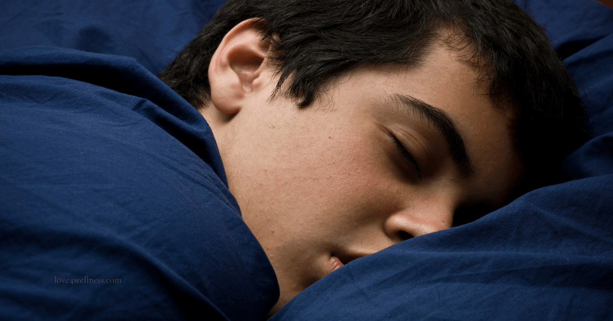 Teenage boy sleeping soundly in bed — teenage sleep is biology, not laziness