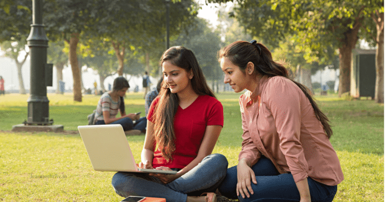 How to choose the right engineering college in India — two Indian college students studying together outdoors