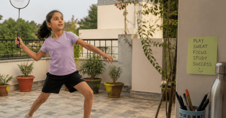 Indian child playing badminton on a home terrace, showing the benefits of movement for children
