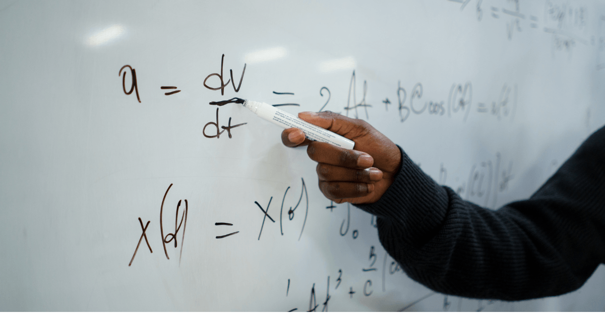 Teacher explaining concepts on a whiteboard — how to choose a coaching institute for your child